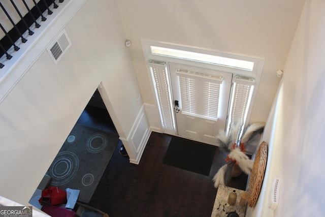 foyer entrance featuring wood-type flooring