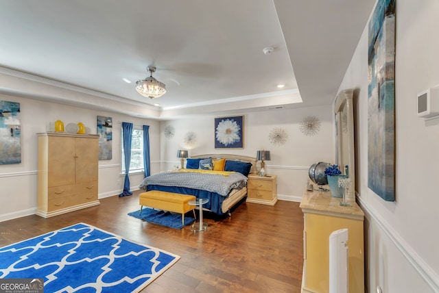 4051 Rotterdam Pass, Hampton, GA 30228 - bedroom featuring a tray ceiling, wood-type flooring, recessed lighting, and baseboards