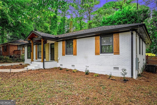 view of front of property with cooling unit and covered porch