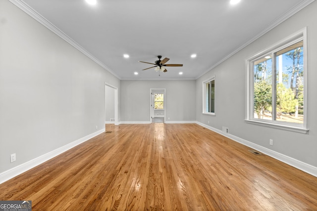 interior space with light hardwood / wood-style floors, ceiling fan, and crown molding