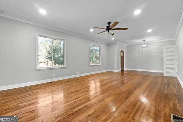 unfurnished living room with crown molding, ceiling fan, and hardwood / wood-style flooring