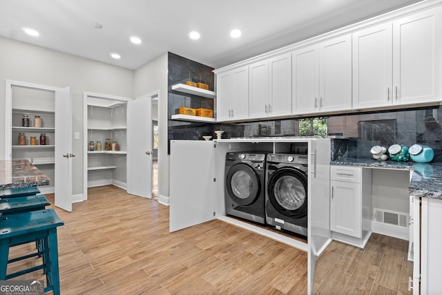 laundry area featuring washing machine and clothes dryer