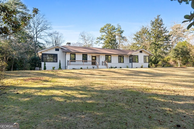 ranch-style house with a front lawn