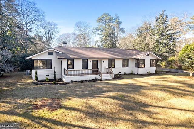 single story home featuring a front lawn and central AC unit