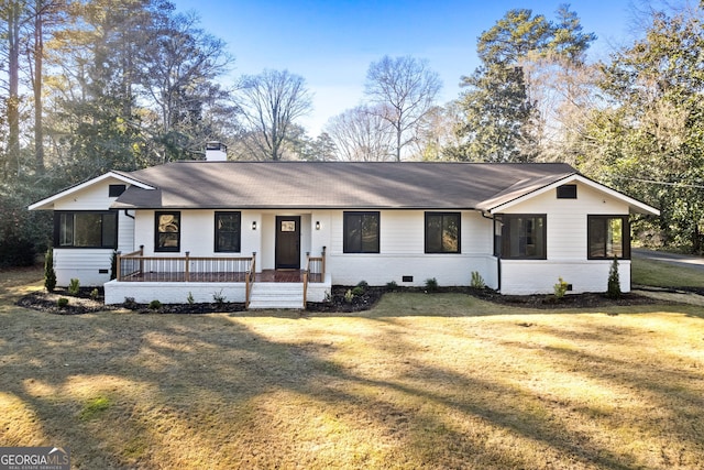 single story home featuring covered porch and a front yard