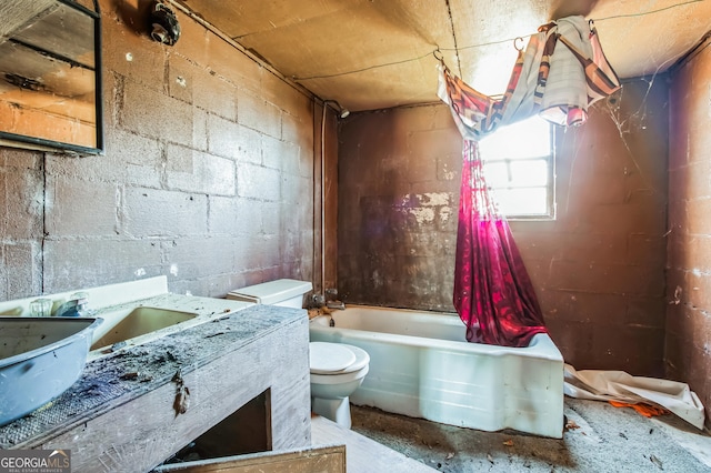 full bathroom featuring vanity, toilet, concrete flooring, and shower / washtub combination