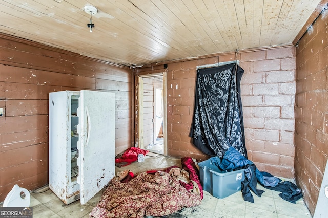 misc room with wood ceiling and wooden walls