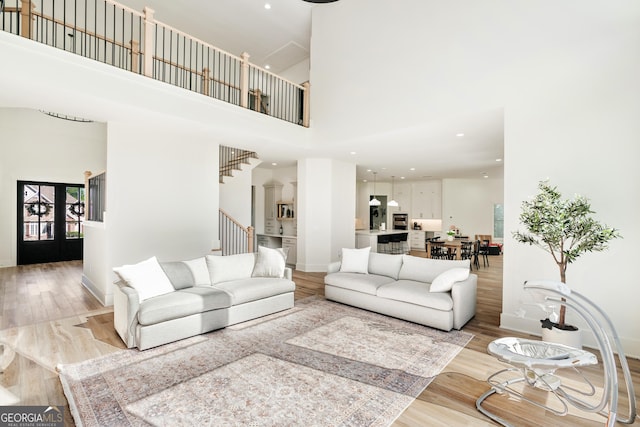 1757 Traditions Way, Jefferson, GA 30549 - living room with a high ceiling and light hardwood / wood-style floors