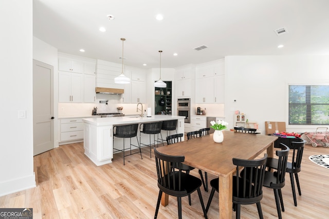 1757 Traditions Way, Jefferson, GA 30549 - dining space with sink and light hardwood / wood-style floors