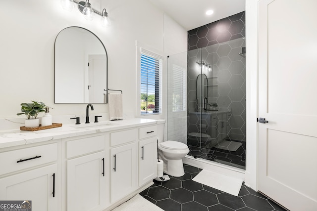 1757 Traditions Way, Jefferson, GA 30549 - bathroom with tile patterned flooring, vanity, toilet, and a shower with shower door