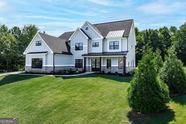 modern inspired farmhouse featuring a porch and a front lawn