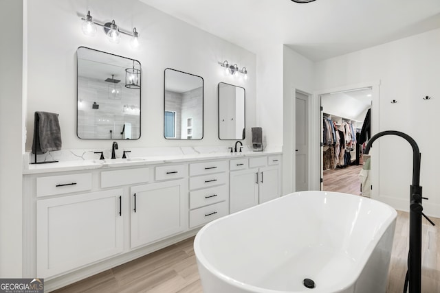 1757 Traditions Way, Jefferson, GA 30549 - bathroom featuring hardwood / wood-style floors, vanity, and independent shower and bath