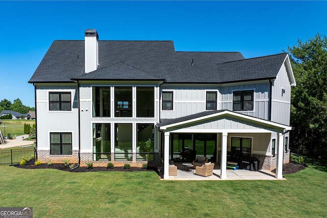 1757 Traditions Way, Jefferson, GA 30549 - rear view of house featuring a patio area, a yard, and an outdoor hangout area