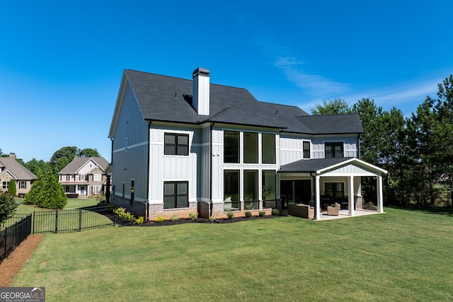 1757 Traditions Way, Jefferson, GA 30549 - back of house with a lawn, an outdoor hangout area, and a patio