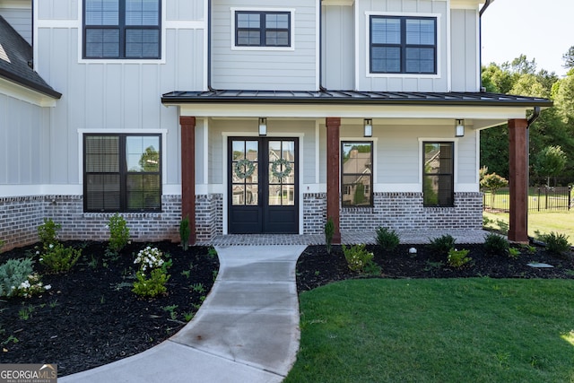 1757 Traditions Way, Jefferson, GA 30549 - doorway to property featuring a lawn and covered porch