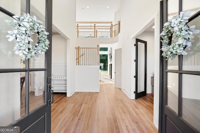 1757 Traditions Way, Jefferson, GA 30549 - foyer entrance with light hardwood / wood-style floors, a high ceiling, and french doors