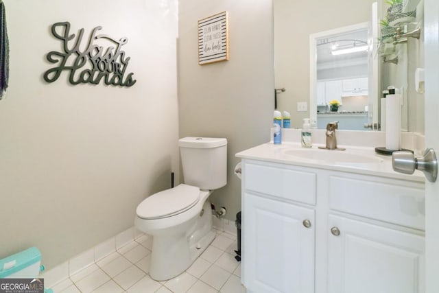 bathroom featuring tile patterned floors, vanity, and toilet