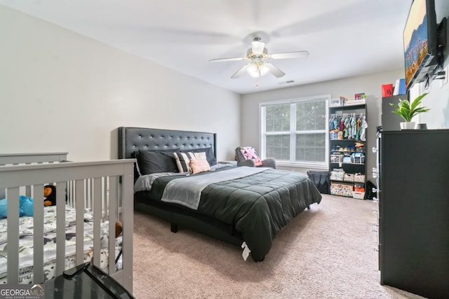 carpeted bedroom with ceiling fan