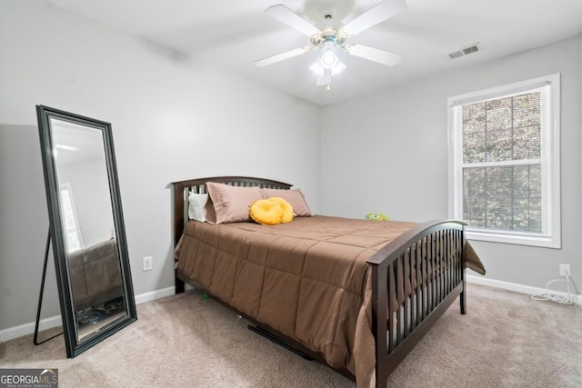 bedroom with light colored carpet and ceiling fan