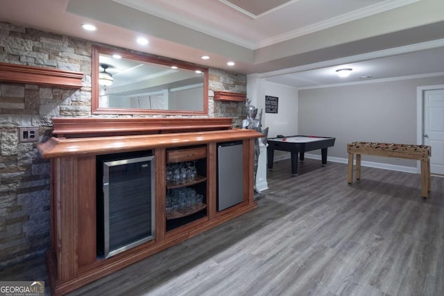 bar featuring wood-type flooring, ornamental molding, wine cooler, and fridge