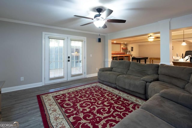 living room featuring ceiling fan, crown molding, dark wood-type flooring, and french doors