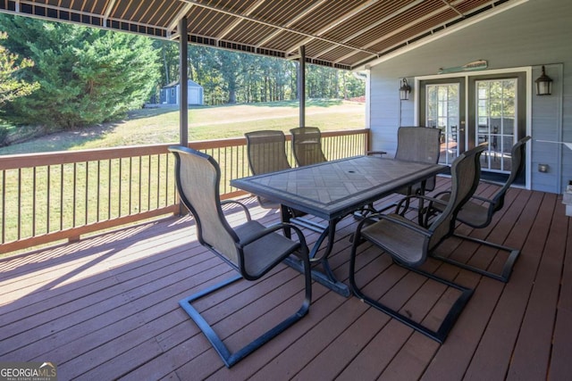 wooden deck featuring a yard