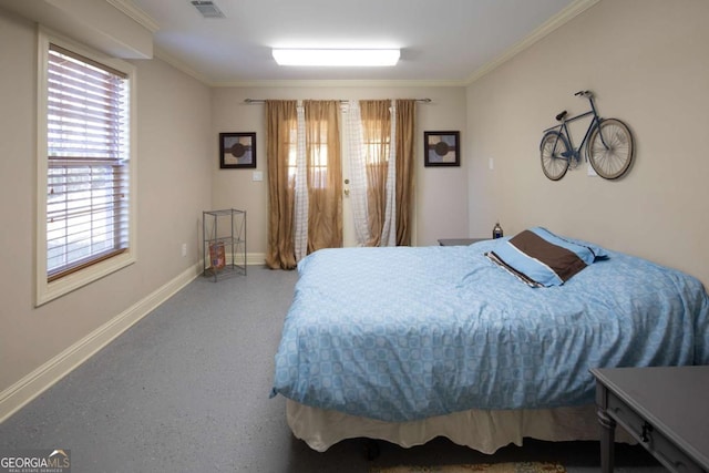 bedroom with multiple windows and crown molding