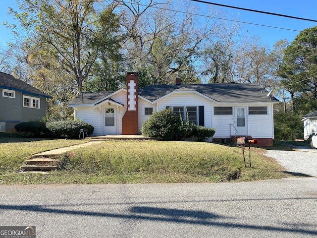 ranch-style home with a front yard