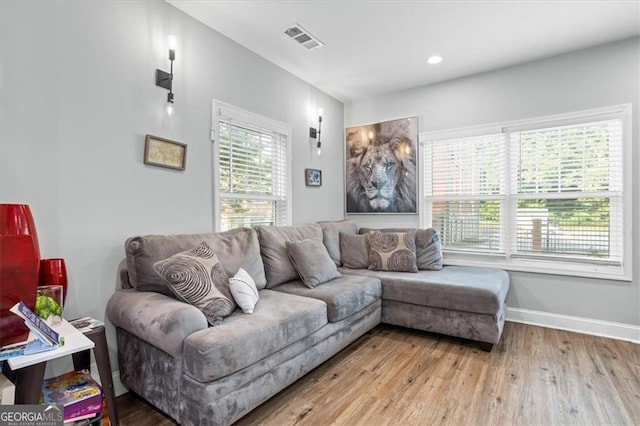 living room with light hardwood / wood-style flooring