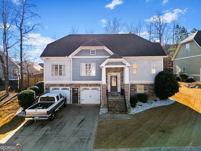 view of front of house featuring a garage and a front lawn