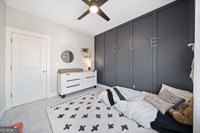 bedroom with ceiling fan and light colored carpet