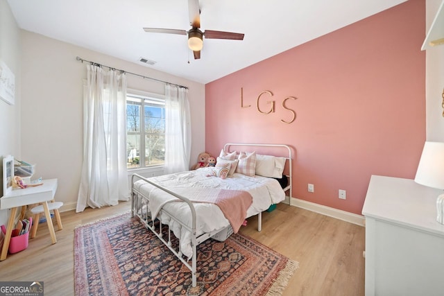 bedroom featuring ceiling fan and light hardwood / wood-style floors