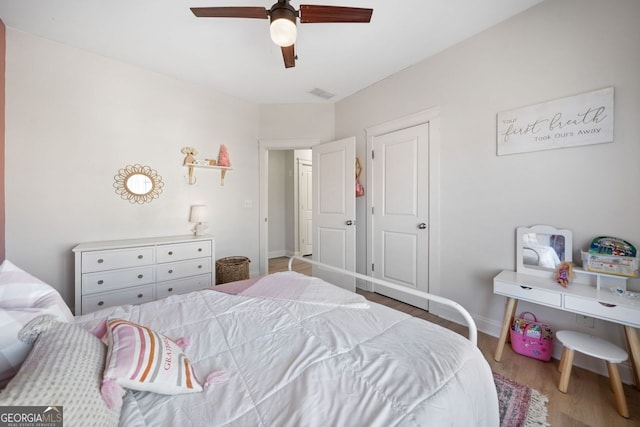 bedroom featuring ceiling fan and wood-type flooring