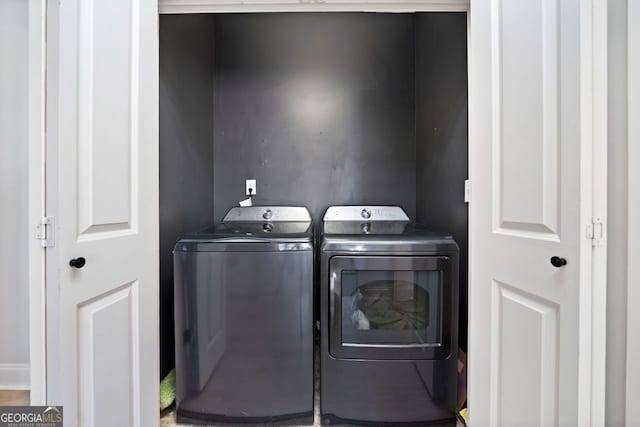 laundry room featuring separate washer and dryer