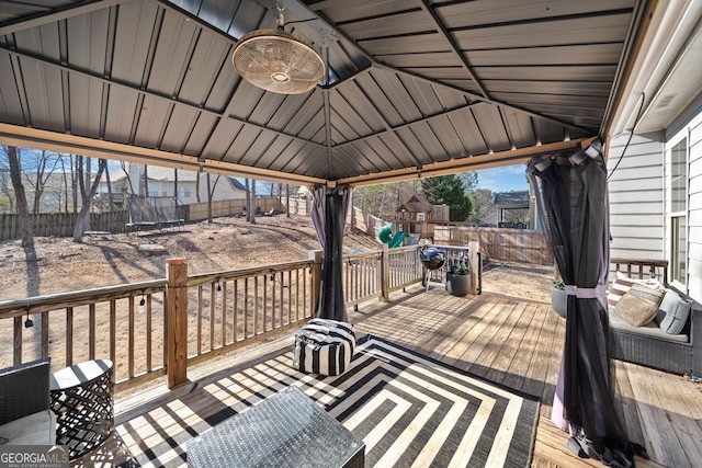 deck featuring a gazebo and a trampoline