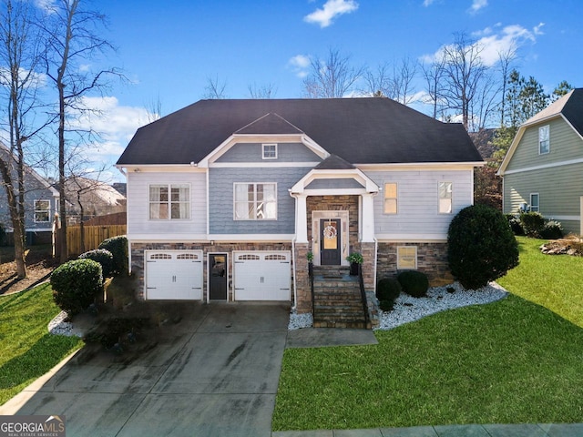 view of front of house featuring a front yard and a garage