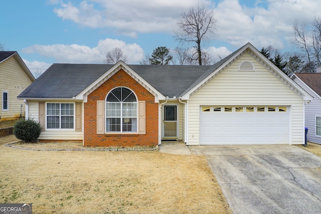 single story home with a garage and a front lawn