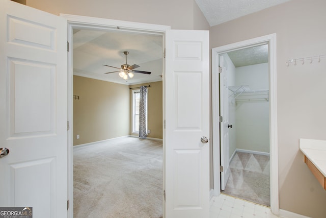 bathroom featuring a textured ceiling and ceiling fan