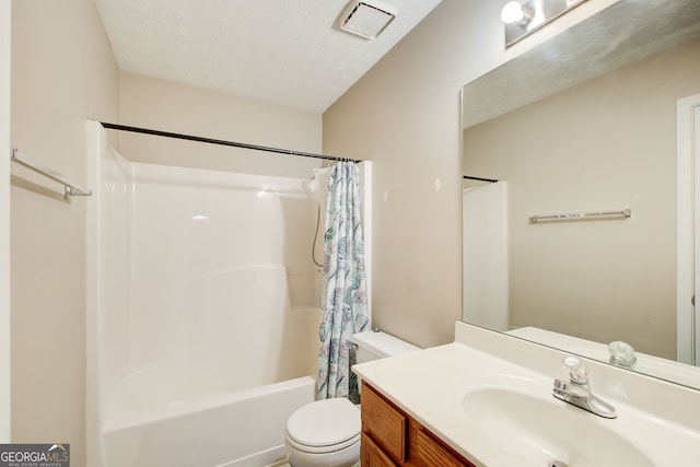 full bathroom featuring vanity, toilet, a textured ceiling, and shower / tub combo with curtain