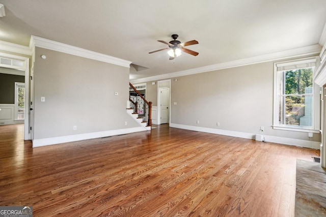 unfurnished living room with ceiling fan, hardwood / wood-style flooring, and ornamental molding