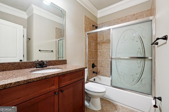 full bathroom featuring vanity, tile patterned floors, crown molding, and enclosed tub / shower combo