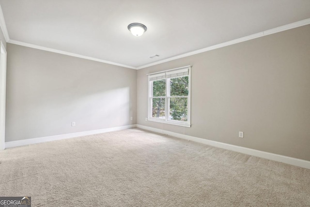 carpeted empty room with ornamental molding