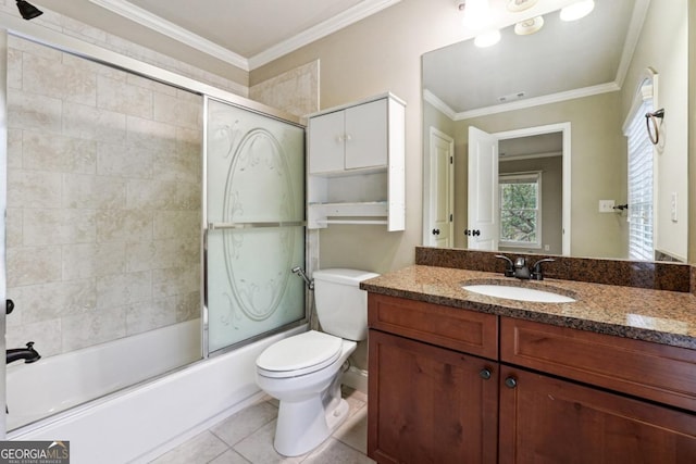 full bathroom featuring vanity, tile patterned floors, toilet, enclosed tub / shower combo, and ornamental molding