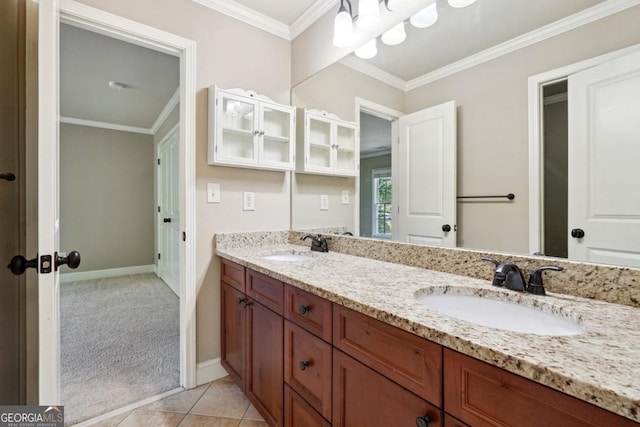 bathroom with tile patterned floors, vanity, and ornamental molding