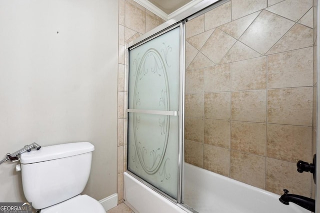 bathroom with crown molding, toilet, and combined bath / shower with glass door