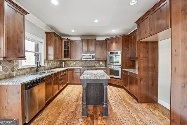 dining area with hardwood / wood-style floors, ceiling fan with notable chandelier, and ornamental molding