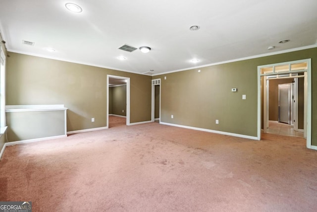 carpeted spare room with ornamental molding