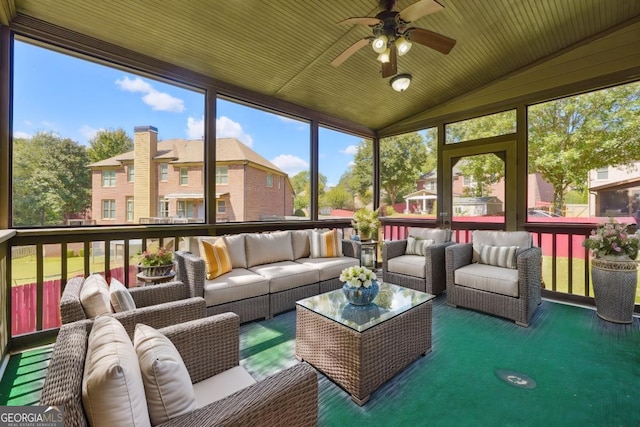 sunroom / solarium featuring ceiling fan, lofted ceiling, and wooden ceiling