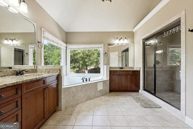 bathroom with crown molding, tile patterned flooring, vanity, and shower with separate bathtub