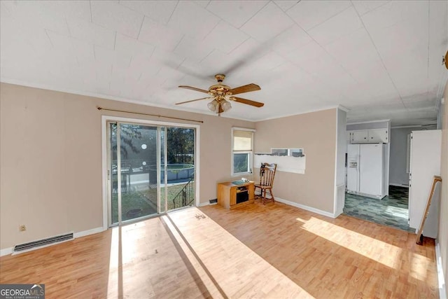 interior space with ceiling fan, light hardwood / wood-style flooring, and ornamental molding